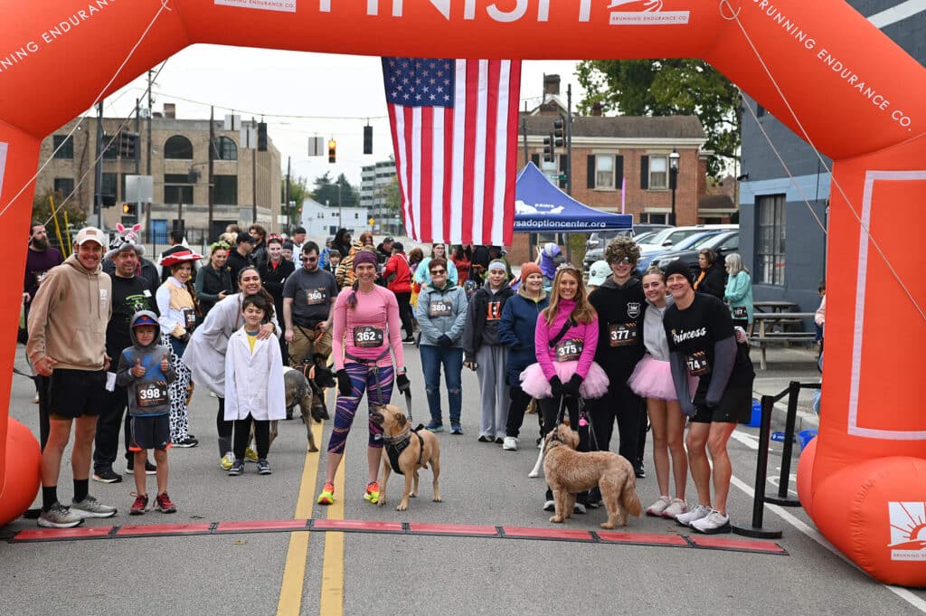 Human and dog racers lined up to start